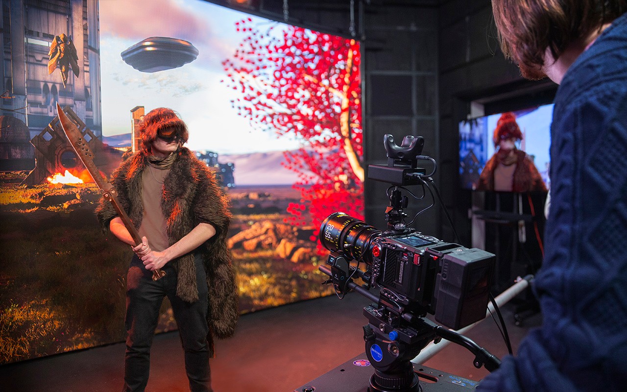 CCM Media Production students create a futuristic scene in the XR Studio.