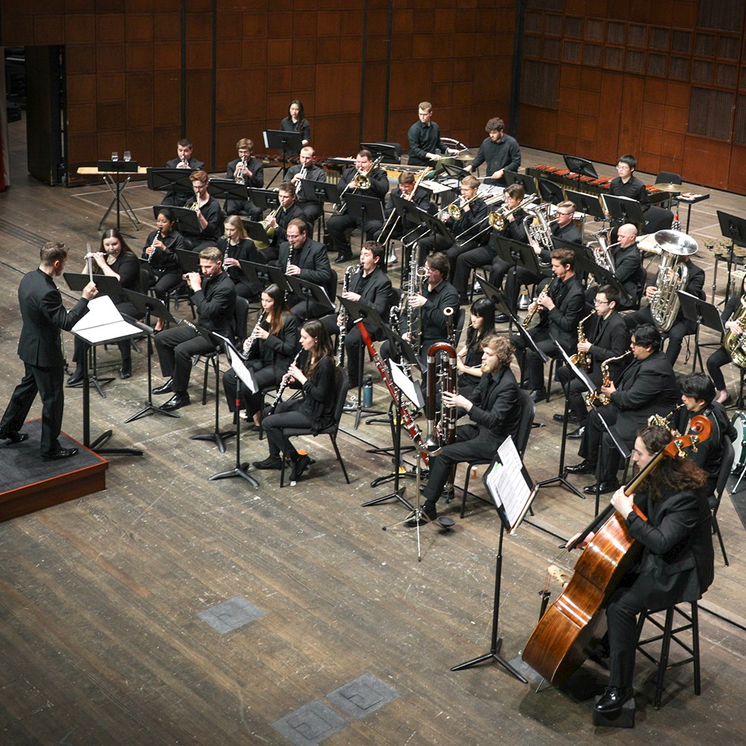 CCM Wind Ensemble performs on stage