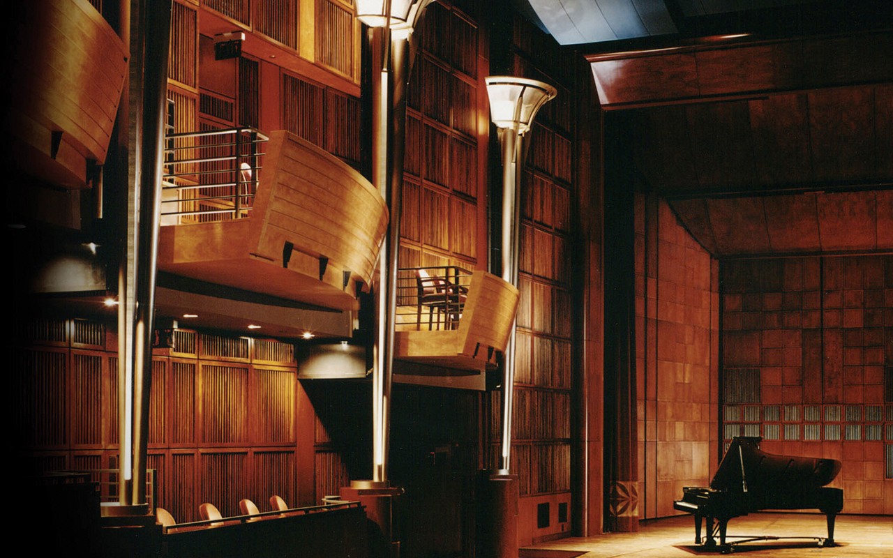 A piano sits on the Corbett Auditorium stage.