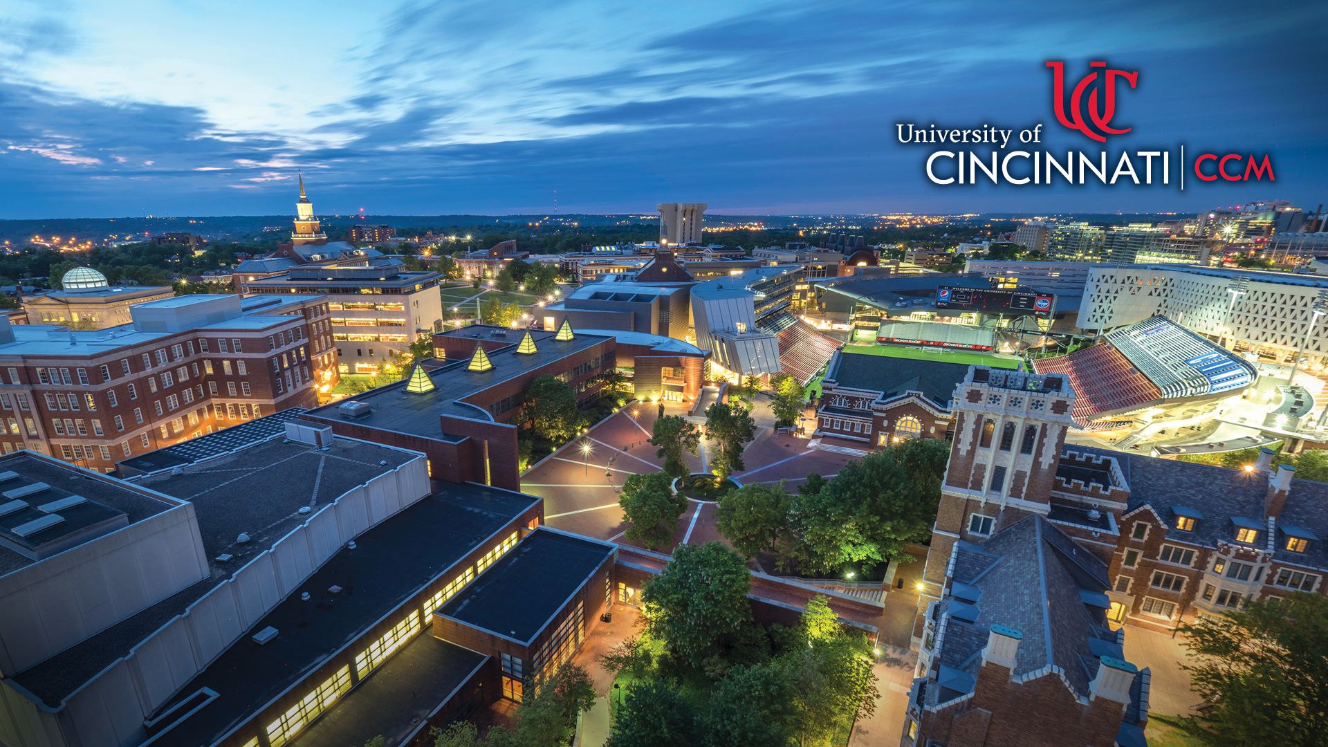 A CCM-branded webinar background featuring a photo of CCM Village at dusk.